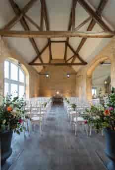 The 18th century Stone Barn is an idyllic setting for your Cotswold barn wedding with its exposed stone walls and soaring rafters