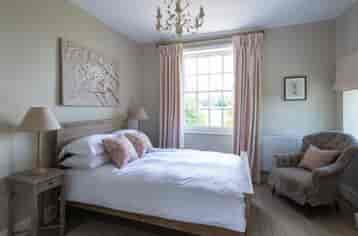 Double bedroom decorated in Cotswold style and available for your wedding night