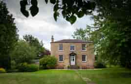 Exterior view of Lapstone Farmhouse, which provides on site accommodation at the wedding venue