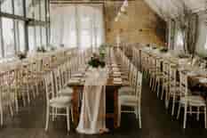 Long tables set for the wedding breakfast